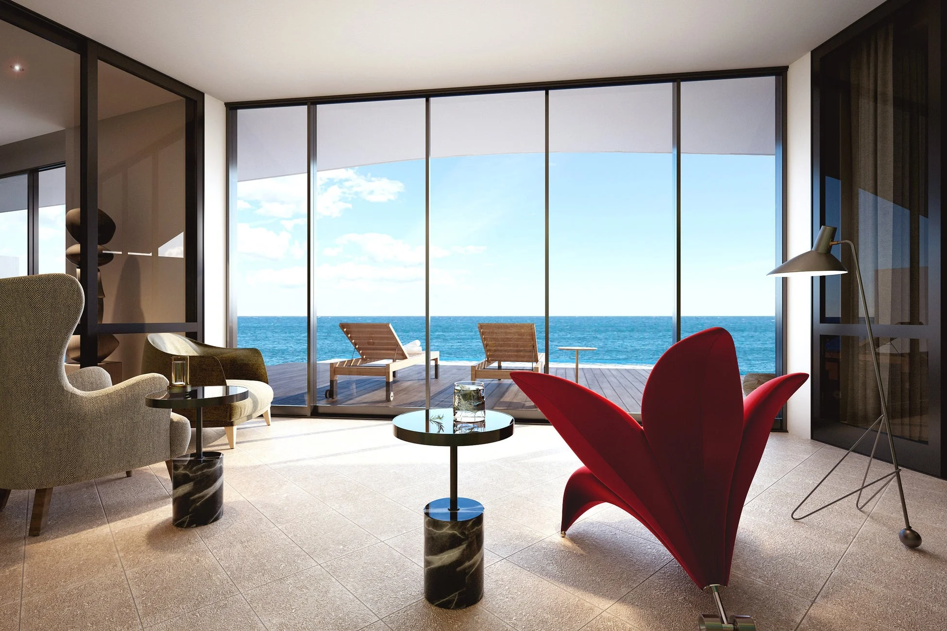 広々としたリビングルームから、大きな窓越しに青い海と空が広がるオーシャンビューの風景